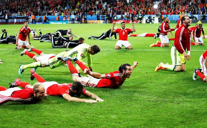 Wales players celebrate their Euro 2016 quarter-final win over Belgium in Lille on Friday
