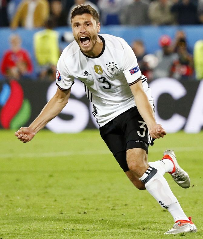 Germany's Jonas Hector celebrates scoring in the penalty shootout against Italy