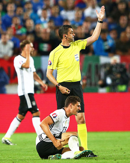 Germany's Mario Gomez lies injured during their Euro 2016 quarter-final match against Italy at Stade Matmut Atlantique in Bordeaux on Saturday