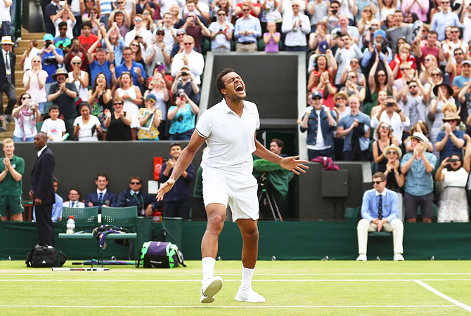 Jo-Wilfried Tsonga of France celebrates his third round victory over the USA's John Isner on Middle Sunday