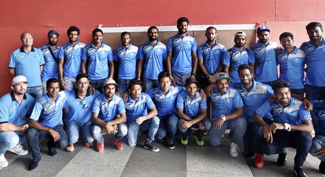 The Indian hockey team, with coach Roeland Oltmans (standing, extreme right)