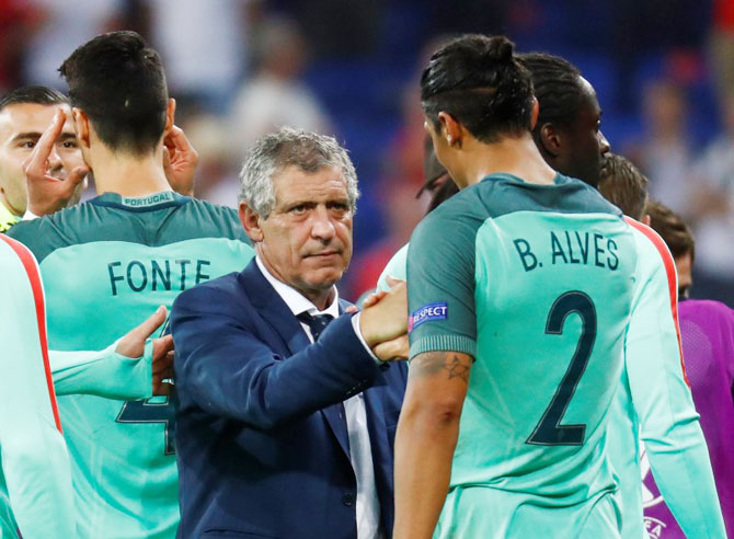 Portugal's coach Fernando Santos celebrates with Bruno Alves at the end of the semi-final against Wales on Wednesday