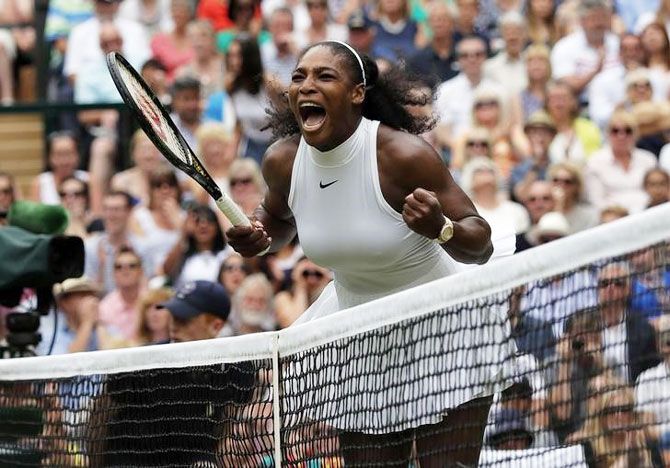 Serena Williams celebrates winning the first set 