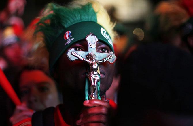 A Portugal fan watches the Euro 2016 final between Portugal and France at a public screening in Lisbon, Portugal, on Sunday