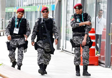 Brazilian Public-Safety National Force personnel patrol at the 2016 Rio Olympics Park in Rio de Janeiro, Brazil on Wednesday