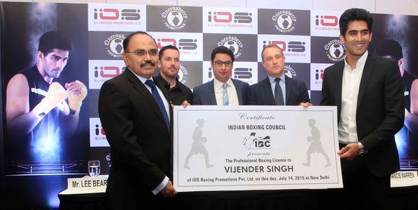 Indian Boxing Council's founder P K Muralidharan Raja offers Vijender Singh his first Pro Boxing License in Delhi on July 14, 2015