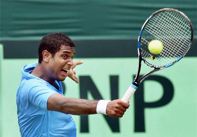 India's Ramkumar Ramanathan returns against Koreas Seon Chan Hong during their Asia/Oceania Group-I Davis Cup tie in Chandigarh on Friday