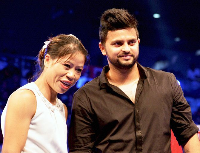 Olympic boxer Mary Kom and cricketer Suresh Raina before the WBO Asia Pacific Middleweight Championship at Thyagaraj Sports Complex in New Delhi on Saturday