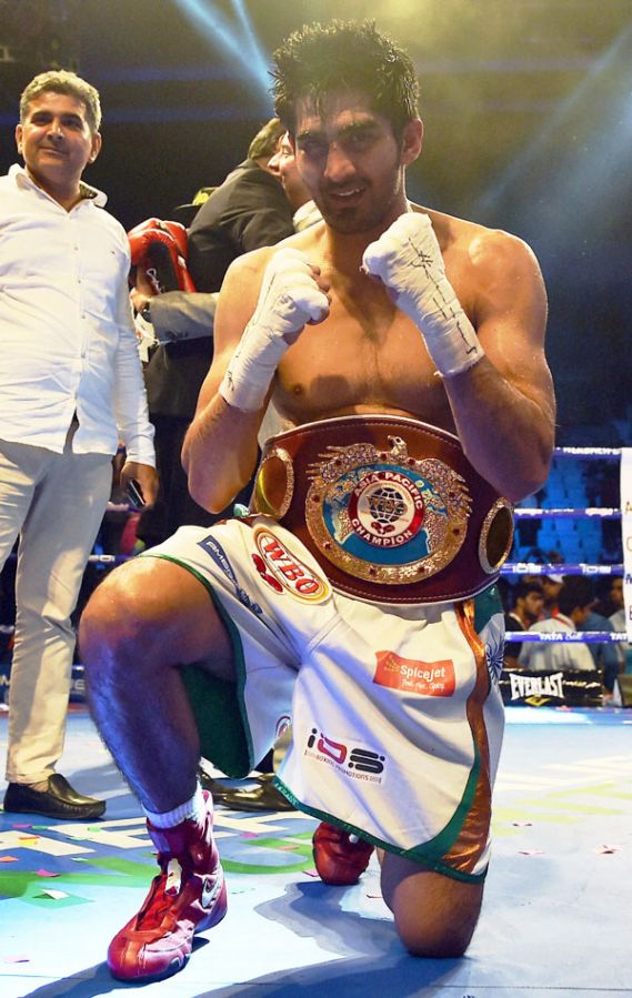 Star Indian boxer Vijender Singh celebrates after beating Australia's Kerry Hope and won the WBO Asia Pacific Super Middleweight Championship at Thyagaraj Sports Complex in New Delhi on Saturday