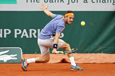 Italian player Marco Cecchinato returns the ball