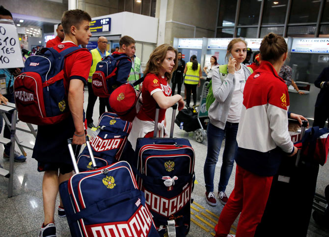 Members of Russia's Olympic team arrive at the airport in Rio de Janeiro, on, July 24, 2016