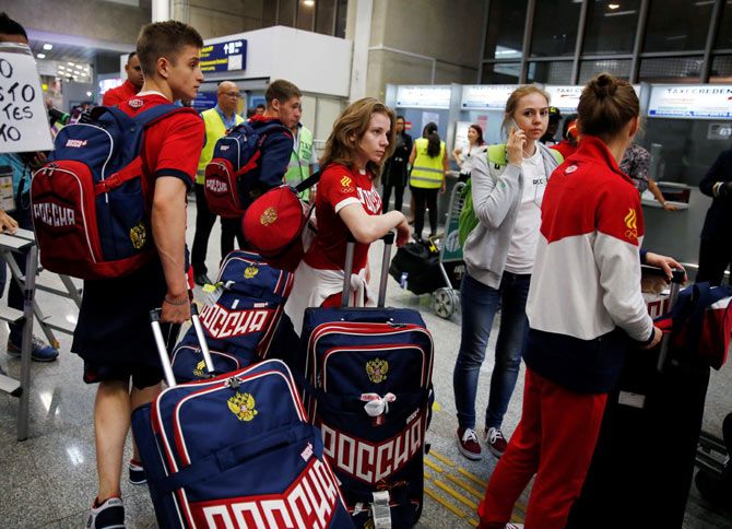 Members of Russia's Olympic team arrive at the airport in Rio de Janeiro, on, July 24, 2016