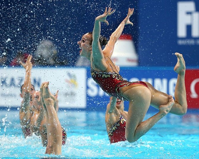 The Russia team compete in the Women's Free Combination Synchronised Swimming Final 
