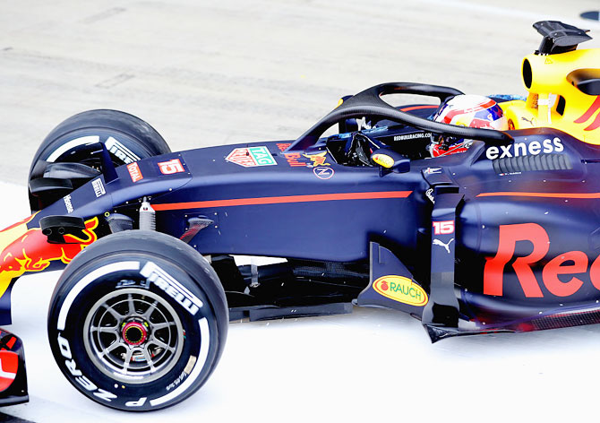 Red Bull Racing's French driver Pierre Gasly drives the Red Bull-TAG Heuer RB12 fitted with the halo safety device during F1 testing at Silverstone Circuit in Northampton, England, on July 12, 2016