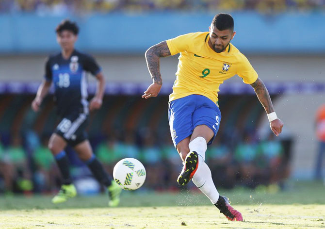 Brazil's Gabriel Barbosa scores against Japan in their 2016 Rio Olympics football friendly in  Goiania, Brazi, on Saturday