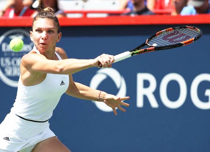 Romania's Simona Halep hits a shot against Germany's Angelique Kerber on day six of the Rogers Cup tennis tournament at Uniprix Stadium in Montreal on Saturday