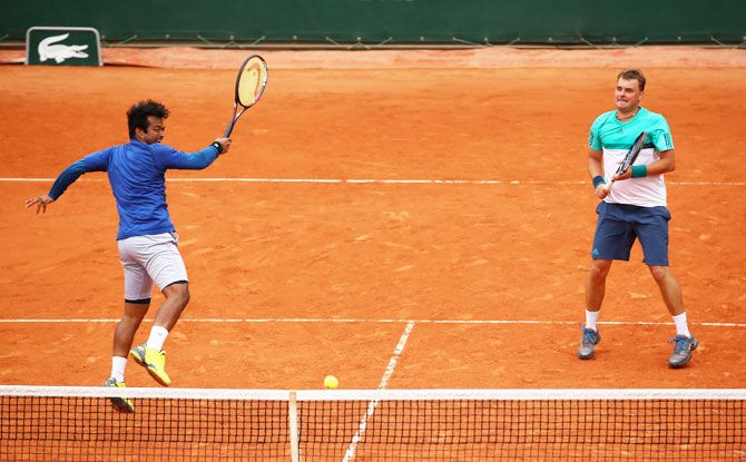 Poland's Marcin Matkowski (right) and India's Leander Paes in action during their men's doubles match at the French Open