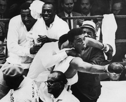Muhammad Ali flies around the ring after beating Sonny Liston in the seventh round of the World Heavyweight Title bout in Miami Beach. It was during these scenes that he claimed, 'I am the Greatest' and 'I shook up the World'