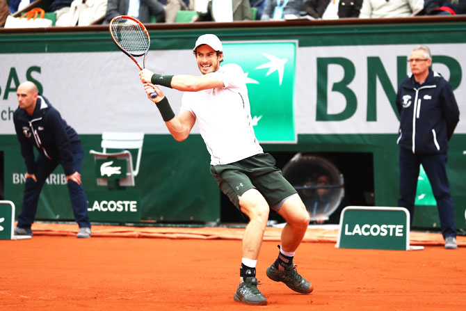 Andy Murray executes a backhand return during the French Open final against Novak Djokovic