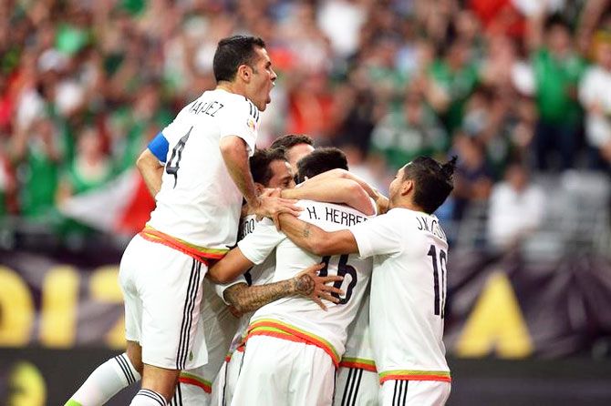   Mexico players celebrate a goal by midfielder Hector Herrera (16) during their Copa America Centenario match against Uruguay in their Group C match at University of Phoenix Stadium in Glendale, Arizona. on Sunday