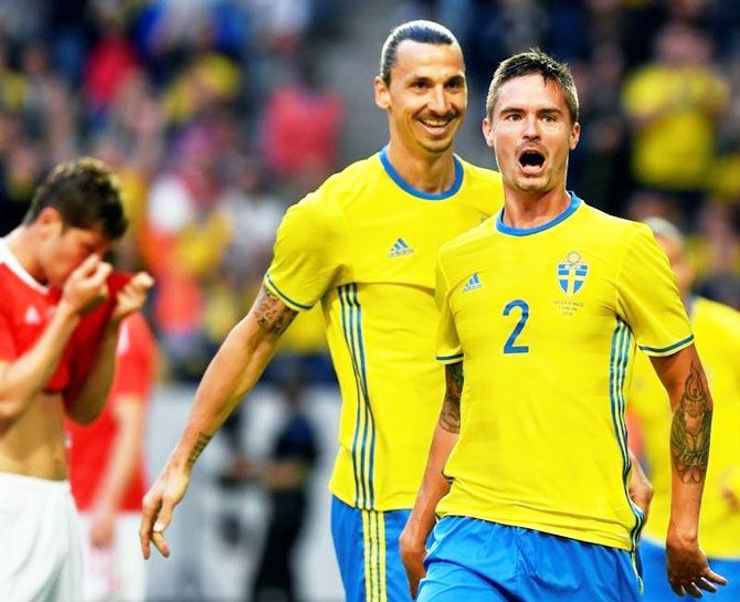 Sweden's Zlatan Ibrahimovic and Mikael Lustig (R) cheer after Lustig's 2-0 goal during the friendly soccer match Sweden v Wales at the Friends Arena in Stockholm, Sweden on Sunday