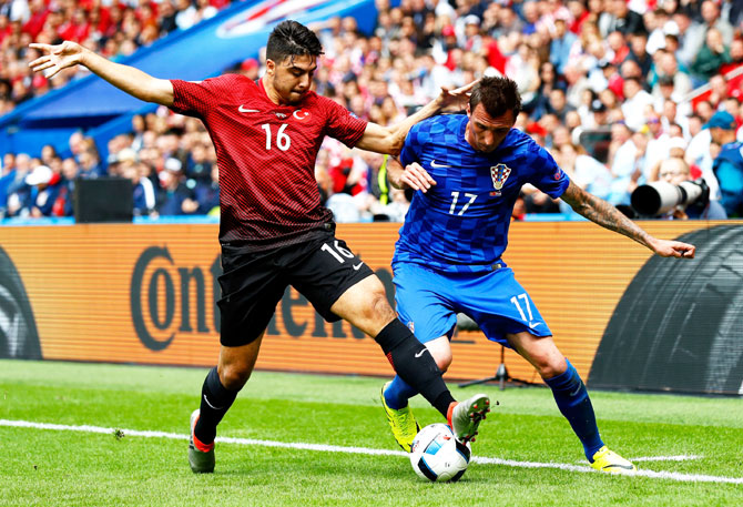 Turkey's Ozan Tufan and Croatia's Mario Mandzukic vie for possession