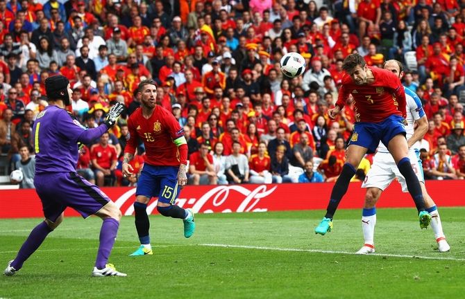 Spain's Gerard Pique (2nd from right) heads the ball to score his team's first goal past of Czech Republic's keeper Petr Cech during their UEFA EURO 2016 Group D match at Stadium Municipal in Toulouse on Monday