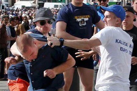 Rival supporters clash at the old port of Marseille before the game between England and Russia on Saturday, June 11