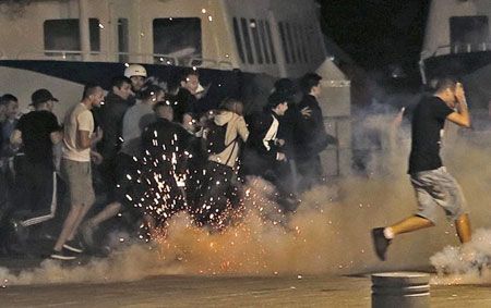  Police disperse revellers at the old port of Marseille after the England v Russia - Group B match on Saturday