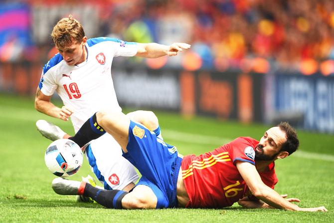 Czech Republic's Ladislav Krejci is challenged by Spain's Juanfran