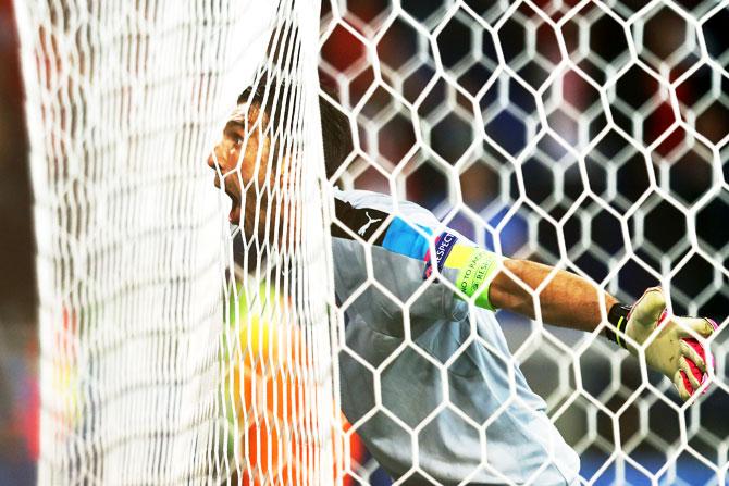 Italy captain Gianluigi Buffon celebrates his team's 2-0 win over Belgium after their UEFA EURO 2016 Group E match at Stade des Lumieres in Lyon on Monday