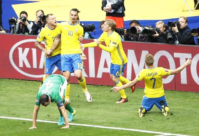 Sweden's John Guidetti, Emil Forsberg and Zlatan Ibrahimovic celebrate after Republic of Ireland's Ciaran Clark scores an own goal and Sweden's first during their Group E match in Saint-Denis near Paris on Monday