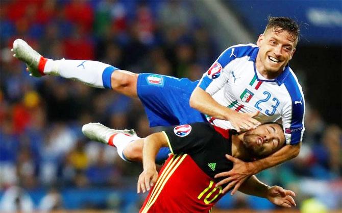 Italy's Emanuele Giaccherini and Belgium's Eden Hazard vie for possession