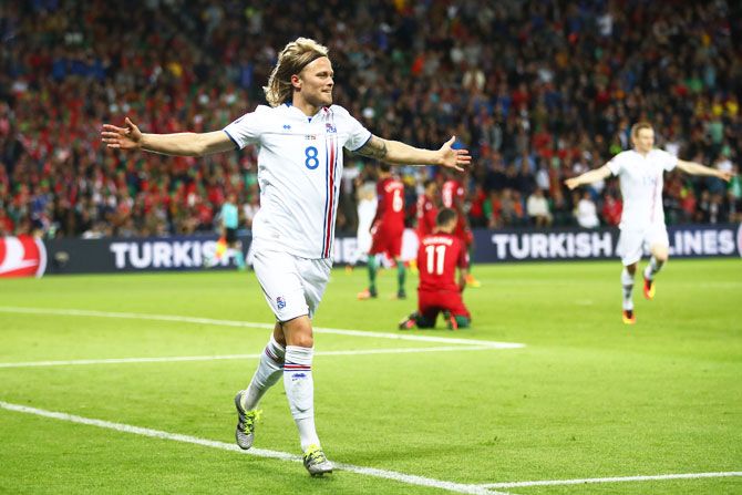 Iceland's Birkir Bjarnason celebrates scoring the equaliser against Portugal