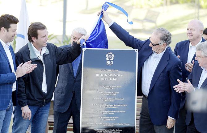 (From left-right) Minister of Sports Leonardo Picciani, Rio de Janeiro's Major Eduardo Paes, Rio 2016 Olympic Games Organising Committee President Carlos Arthur Nuzman and IOC President Thomas Bach during the unveiling of the 2016 Rio Games Athletes’ Village in Rio de Janeiro on Wednesday