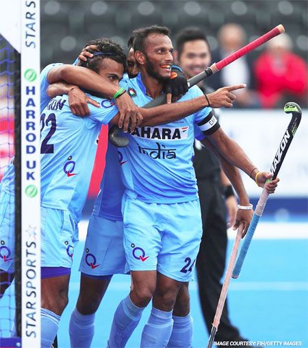 India hockey players celebrate a goal