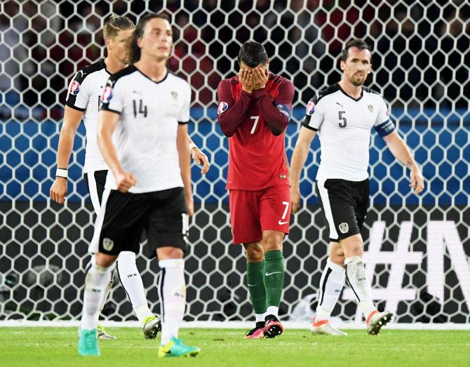 Portugal's Cristiano Ronaldo reacts after missing the penalty