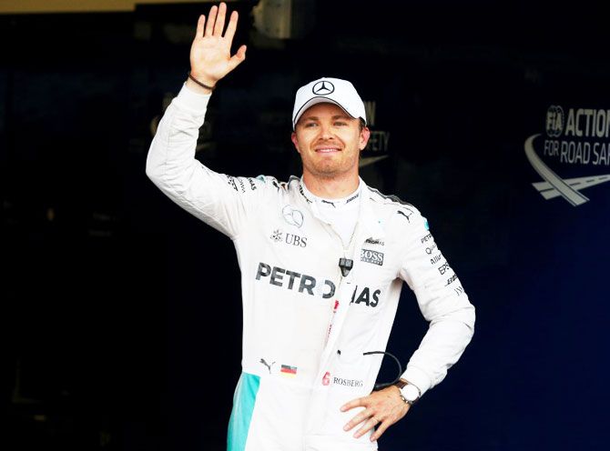 Mercedes Formula One driver Nico Rosberg of Germany waves to photographers after the qualifying session