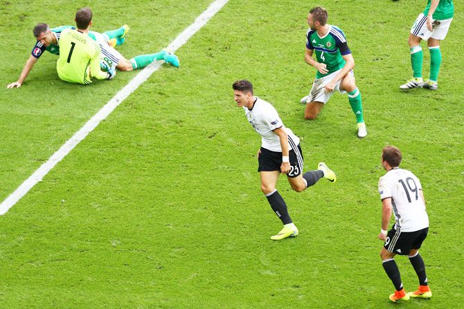 Germany's Mario Gomez (centre) celebrates scoring the opening goal against Northern Ireland during their Euro 2016 Group C match at Parc des Princes in Paris on Tuesday