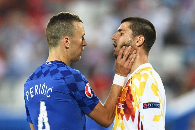Croatia's Ivan Perisic and Spain's Alvaro Morata face off