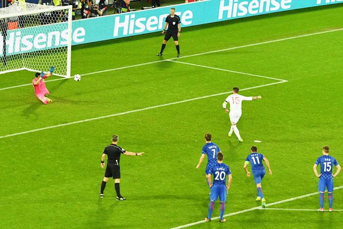 Croatia keeper Danijel Subasic saves a penalty kick by Spain captain Sergio Ramos