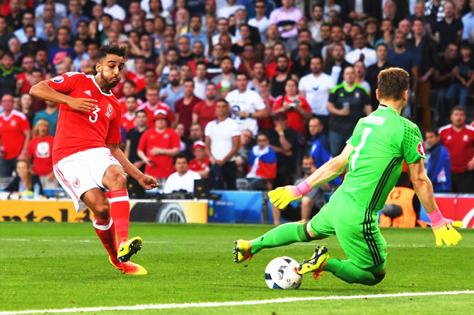 Wales' Neil Taylor scores his team's second goal past Russia keeper Igor Akinfeev