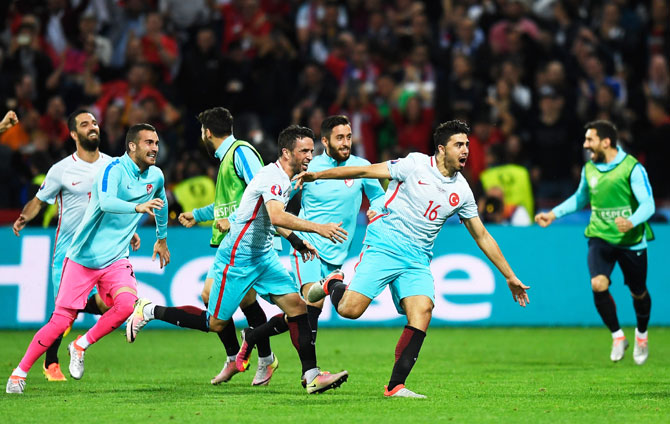 Turkey's Ozan Tufan (right) celebrates scoring his team's second goal against Czech Republic during their Euro 2016 Group D match at Stade Bollaert-Delelis in Lens on Tuesday