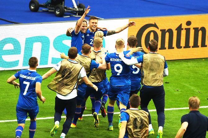 Iceland players celebrate their second goal scored by teammate Arnor Ingvi Traustason during their Euro 2016 Group F match against Austria at Stade de France in Paris, on Wednesday