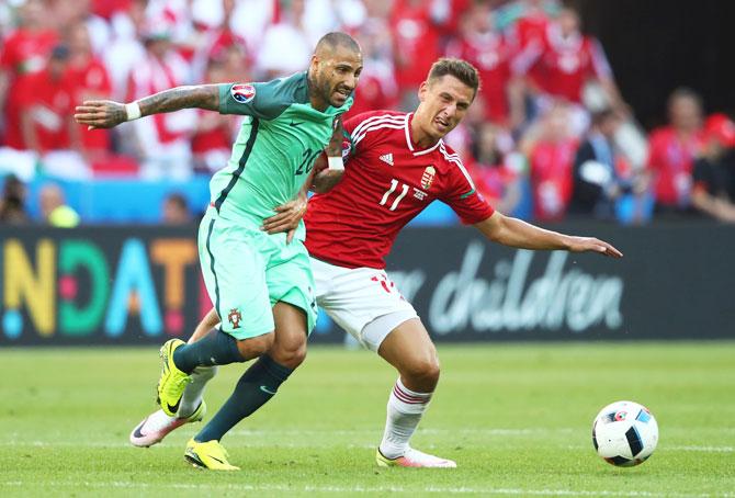 Portugal's Ricardo Quaresma and Hungary's Krisztian Nemeth compete for the ball