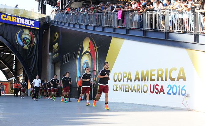 Members of Venezuela enter the field before the 2016 Copa America Centenario quarterfinal match against Argentina at Gillette Stadium in Foxboro, Massachusetts