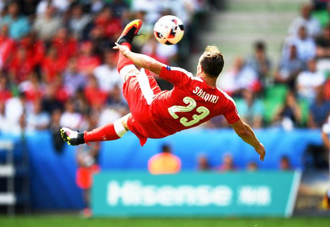 Xherdan Shaqiri of Switzerland scores his team's first goal