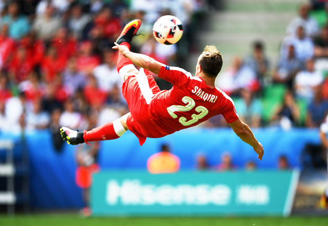 Xherdan Shaqiri of Switzerland scores his team's first goal