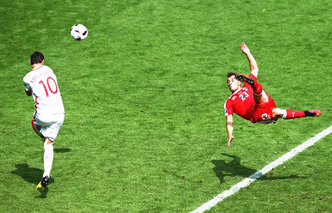 Switzerland's Xherdan Shaqiri scores the equalising goal against Poland during their Euro 2016 round of 16 match at Stade Geoffroy-Guichard in Saint-Etienne, on Saturday