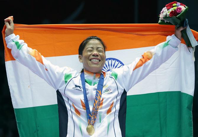 Mary Kom celebrates her gold medal at the 2014 Asian Games in Incheon, South Korea, October 1, 2014. Photograph: Chung Sung-Jun/Getty Images